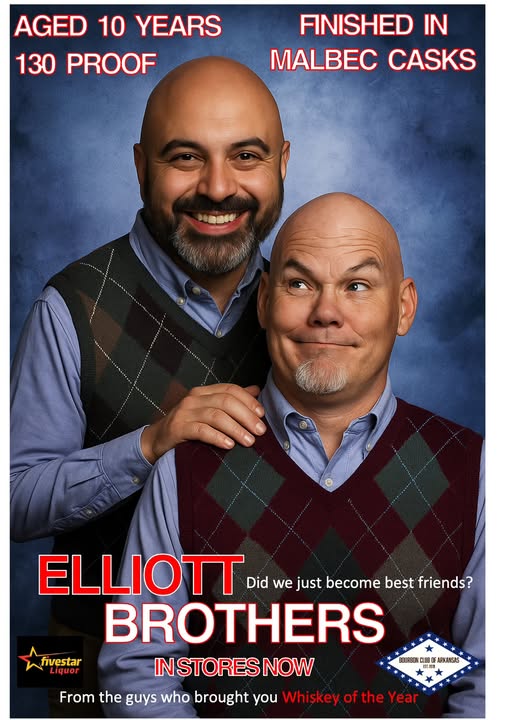 Promotional poster showing two smiling bald men (Sam Rad & David Chaloupka) in argyle sweaters; text reads “Aged 10 years, 130 proof, finished in Malbec casks,” “Elliott Brothers,” “In stores now,” and “Did we just become best friends?”