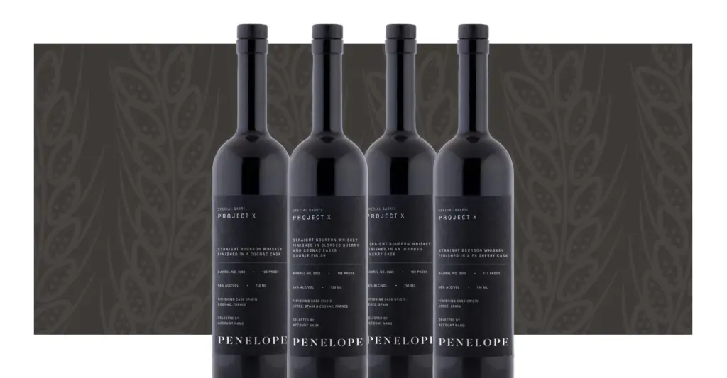 4 Penelope Project X Bottles with a black wheat background followed by a white boarder