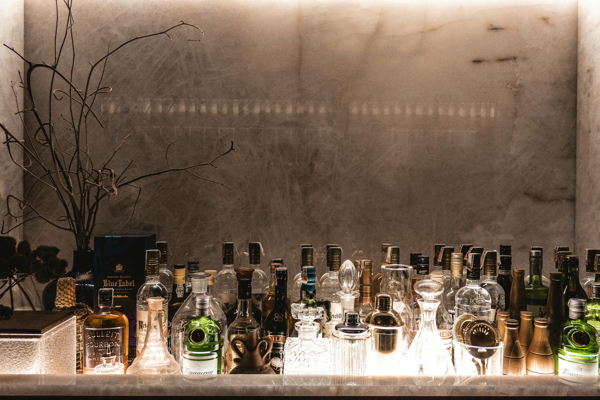 A sophisticated bar setup showcasing various liquor bottles for an upscale ambiance.