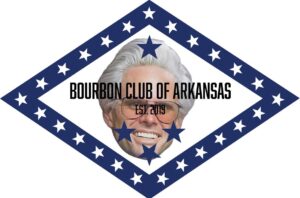 Bourbon Club of Arkansas logo with a blue diamond border of white stars, the text “BOURBON CLUB OF ARKANSAS” and “EST. 2013,” and a central illustration of a bearded man wearing a hat.