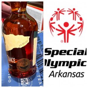 Bottle of Trace bourbon (45% alc/vol) next to the Special Olympics Arkansas logo.