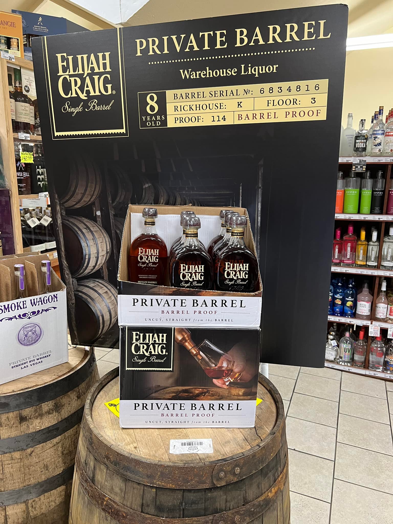 Elijah Craig “Private Barrel” single-barrel bourbon store display showing three bottles; sign reads 8 years old, barrel proof 114, warehouse liquor, barrel serial no. 6834816 (Rickhouse K, Floor 3).