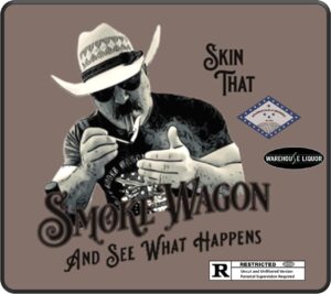 A stylized promotional graphic showing a man wearing a cowboy hat and sunglasses lighting a cigar. Large decorative text says “Smoke Wagon” with the slogan “And See What Happens.” The design includes logos for the Bourbon Club of Arkansas and Warehouse Liquor, plus a small “R – Restricted” label indicating an uncut and unfiltered version. The overall background is a muted brown color and the graphic has a vintage, Western feel.