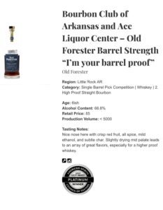 A clear whiskey bottle of Old Forester Barrel Strength single barrel bourbon standing upright next to a small sealed sample vial. The bottle’s label shows it’s a high-proof straight bourbon selected by the Bourbon Club of Arkansas and Ace Liquor Center, called “I’m Your Barrel Proof.” The amber whiskey inside is a rich copper color, and the label beneath the bottle shows tasting notes and a platinum award medallion graphic. The background of the photo is plain white.