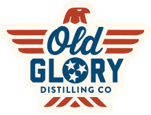 Old Glory Distilling Co distillery logo in red, white, and blue with eagle icon